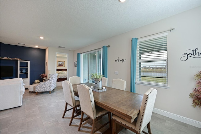 dining area with a textured ceiling