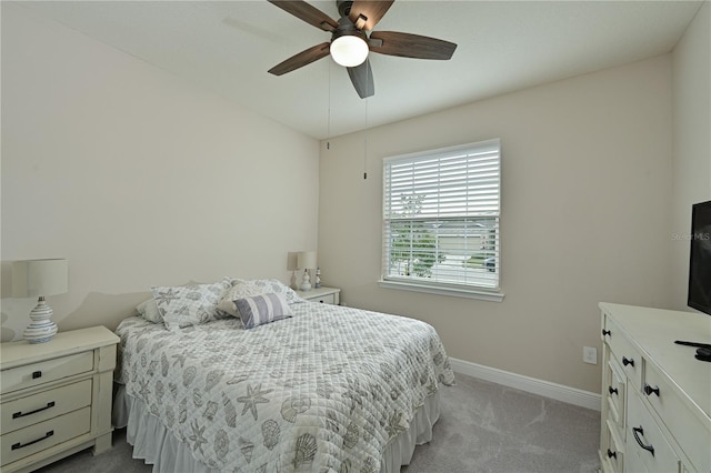 bedroom featuring ceiling fan and light carpet