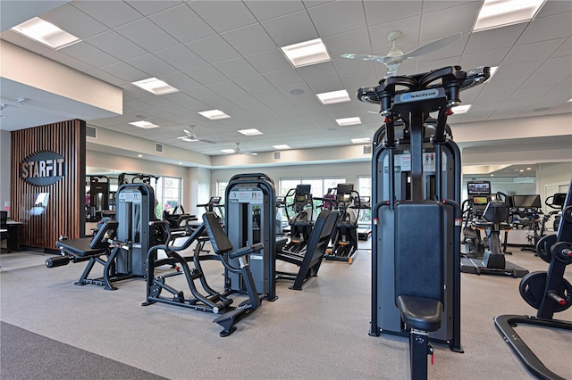 exercise room featuring a paneled ceiling