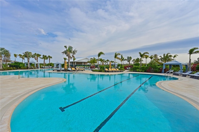 view of swimming pool featuring a gazebo and a patio area