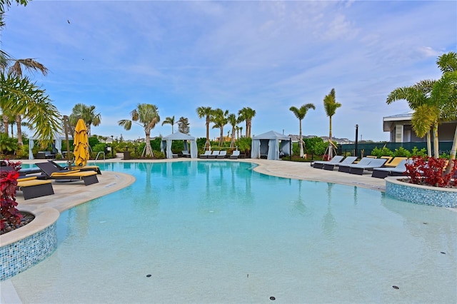 view of swimming pool featuring a gazebo and a patio