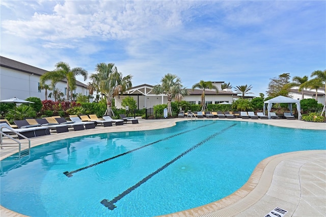 view of swimming pool with a gazebo and a patio