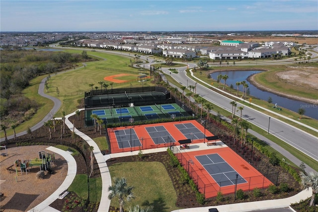 birds eye view of property with a water view