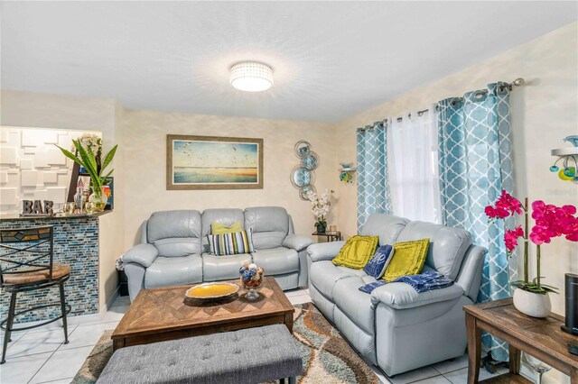 living room with light tile patterned floors