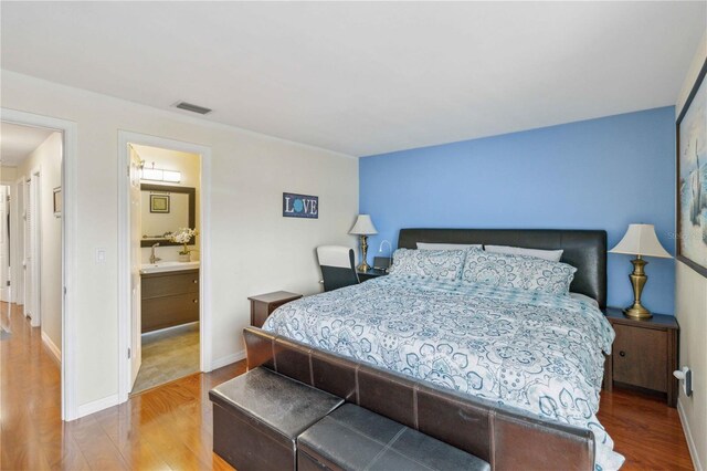 bedroom featuring wood-type flooring