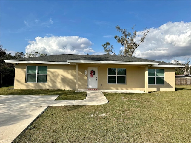 ranch-style home with a front lawn