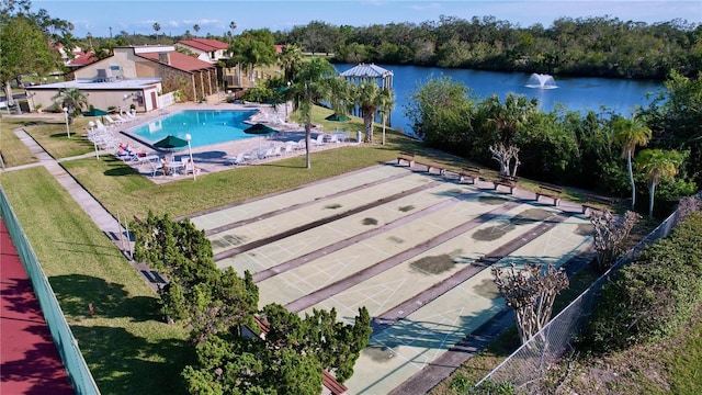 birds eye view of property with a water view