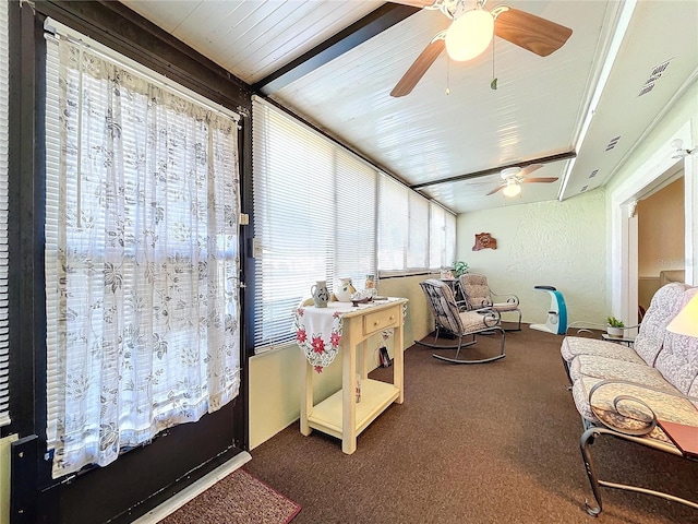 sunroom featuring ceiling fan