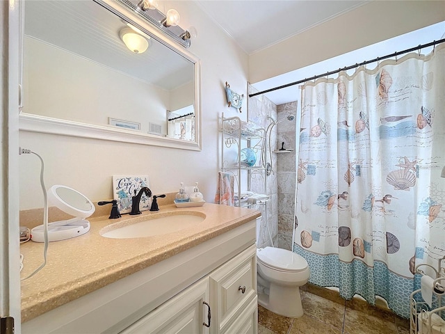 bathroom with vanity, curtained shower, and toilet