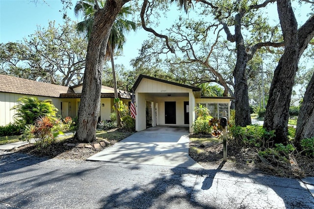 ranch-style house featuring a carport