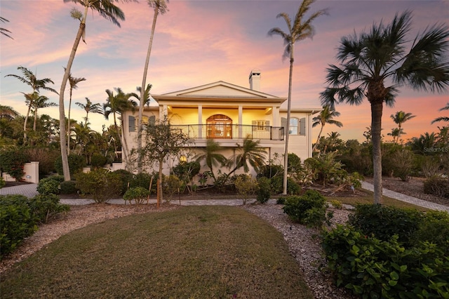16475 Captiva Dr, Captiva, FL 33924 - coastal home featuring a balcony, a chimney, and a yard