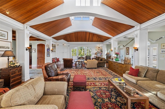 16475 Captiva Dr, Captiva, FL 33924 - living area with ornate columns, wood ceiling, arched walkways, and vaulted ceiling