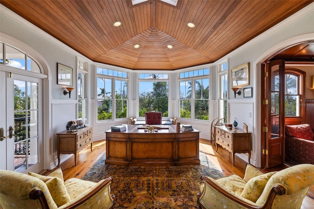 16475 Captiva Dr, Captiva, FL 33924 - office area featuring ornamental molding, wooden ceiling, a decorative wall, arched walkways, and wood finished floors