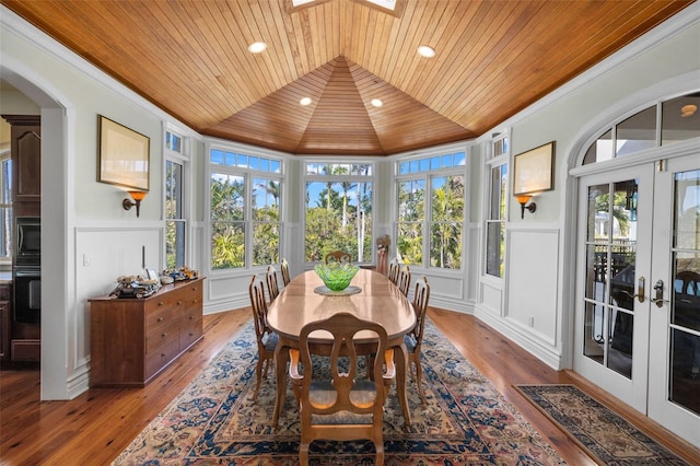 16475 Captiva Dr, Captiva, FL 33924 - sunroom / solarium featuring wood ceiling, a decorative wall, french doors, wood-type flooring, and wainscoting