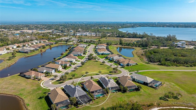 drone / aerial view with a water view