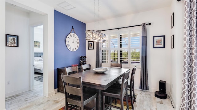 dining area with light hardwood / wood-style flooring