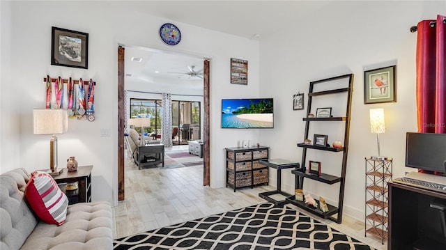 hallway with light hardwood / wood-style flooring