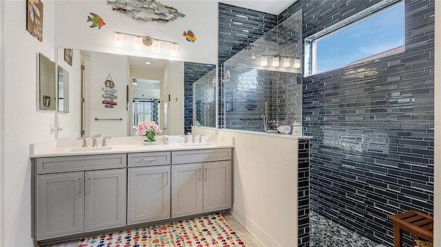 bathroom featuring vanity and a tile shower