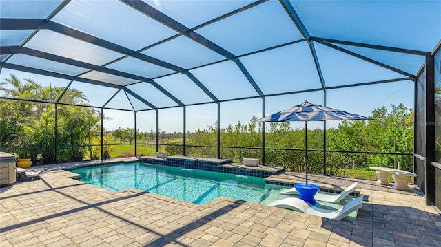 view of pool featuring a patio, a jacuzzi, and glass enclosure