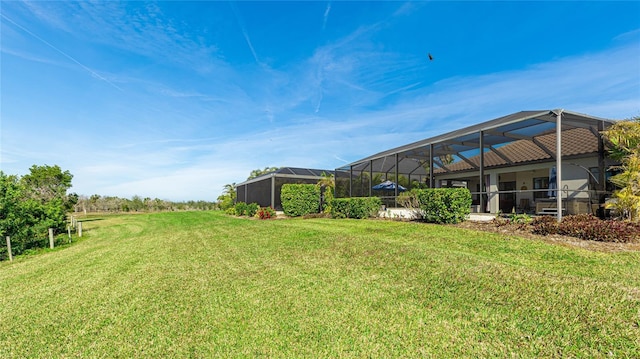 view of yard featuring glass enclosure