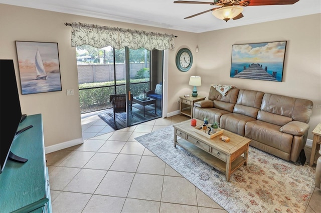 tiled living room with ornamental molding and ceiling fan