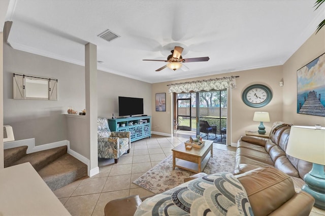 living room with light tile patterned floors, ornamental molding, and ceiling fan