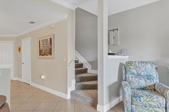 stairway featuring tile patterned flooring and ornamental molding