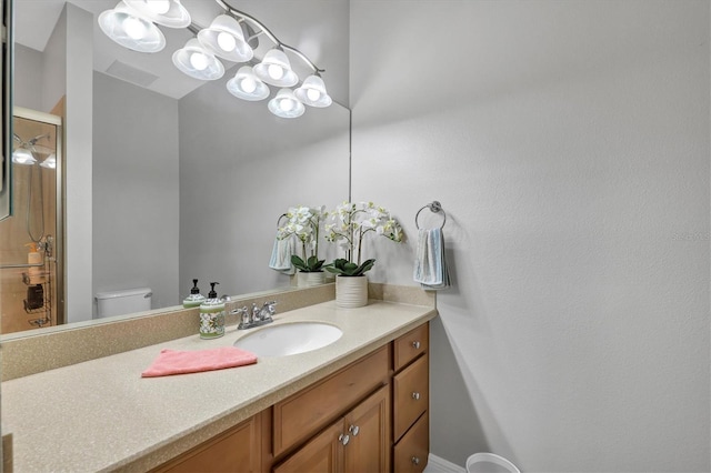 bathroom with vanity and toilet