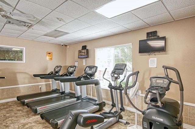 workout area featuring a paneled ceiling