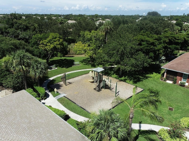 view of home's community featuring a playground and a lawn