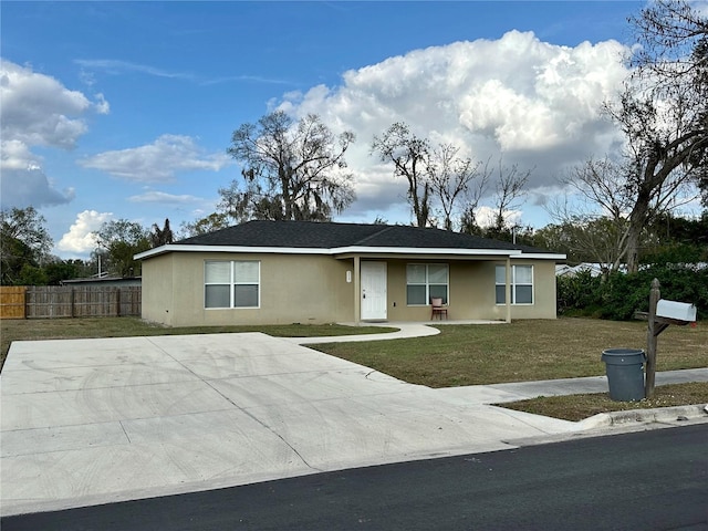 ranch-style house with a front lawn