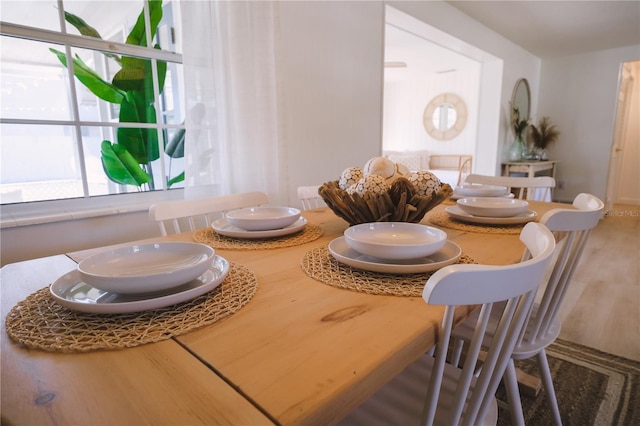 dining space with hardwood / wood-style flooring