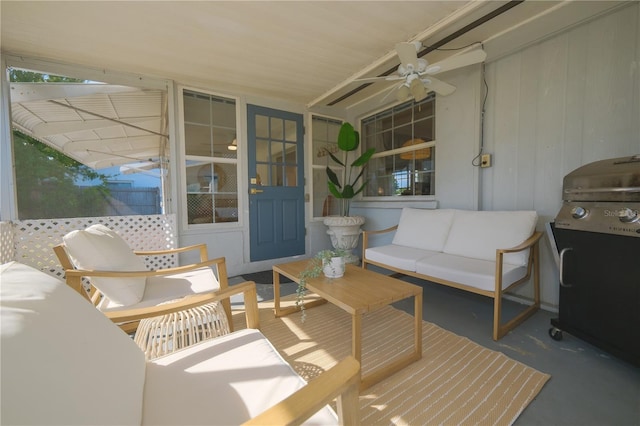 exterior space with an outdoor living space, grilling area, and ceiling fan