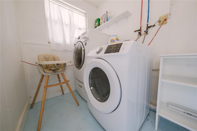 laundry room featuring washing machine and clothes dryer