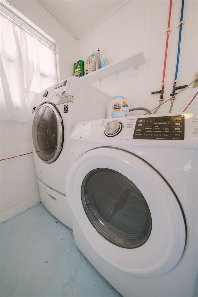 washroom with independent washer and dryer