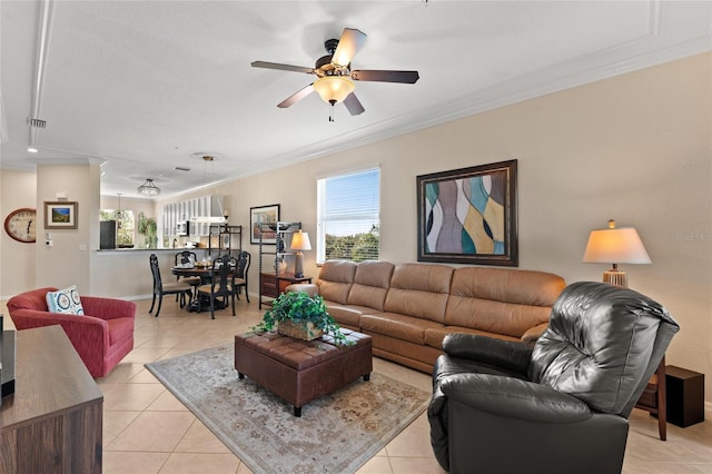 living room featuring crown molding, ceiling fan, and light tile patterned floors