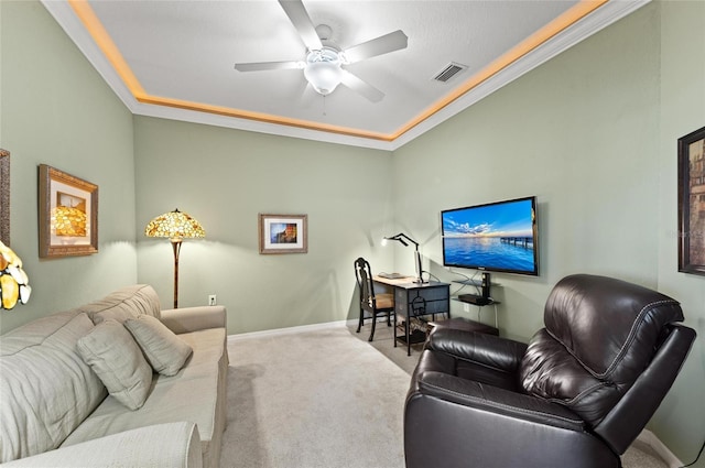 carpeted living room with ornamental molding and ceiling fan