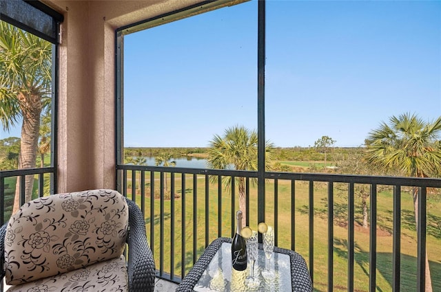 unfurnished sunroom with a water view