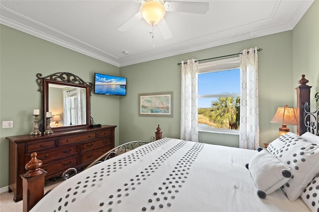 bedroom featuring crown molding, carpet, and ceiling fan