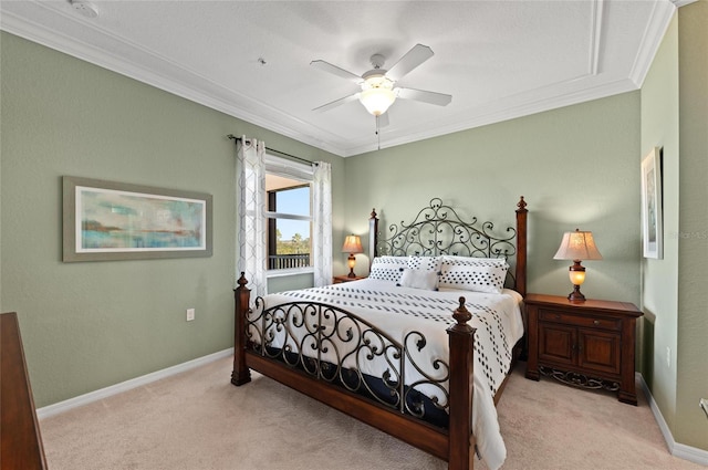 carpeted bedroom with crown molding and ceiling fan