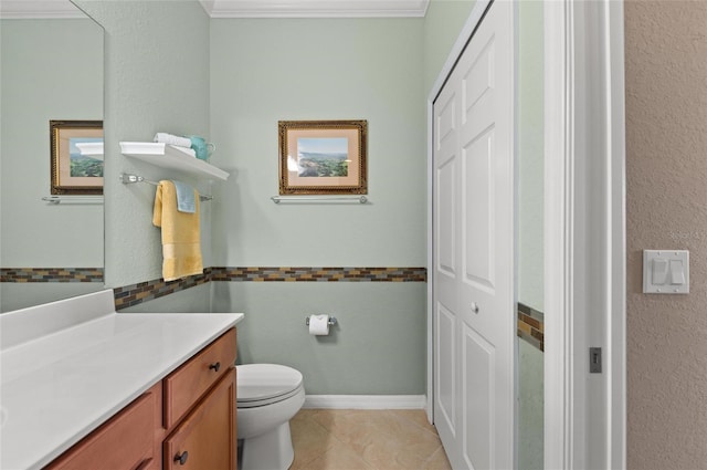 bathroom featuring tile patterned flooring, vanity, and toilet