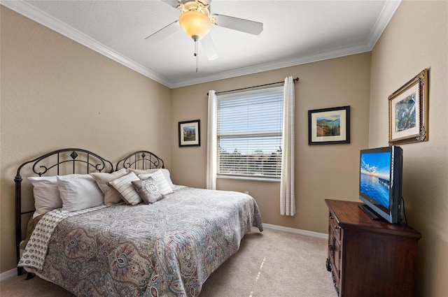 carpeted bedroom featuring ornamental molding and ceiling fan