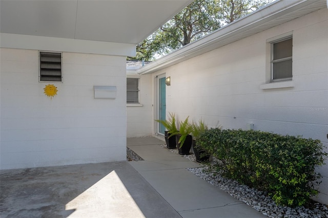 property entrance featuring a patio area