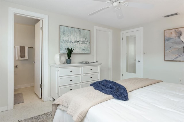 bedroom with connected bathroom and ceiling fan