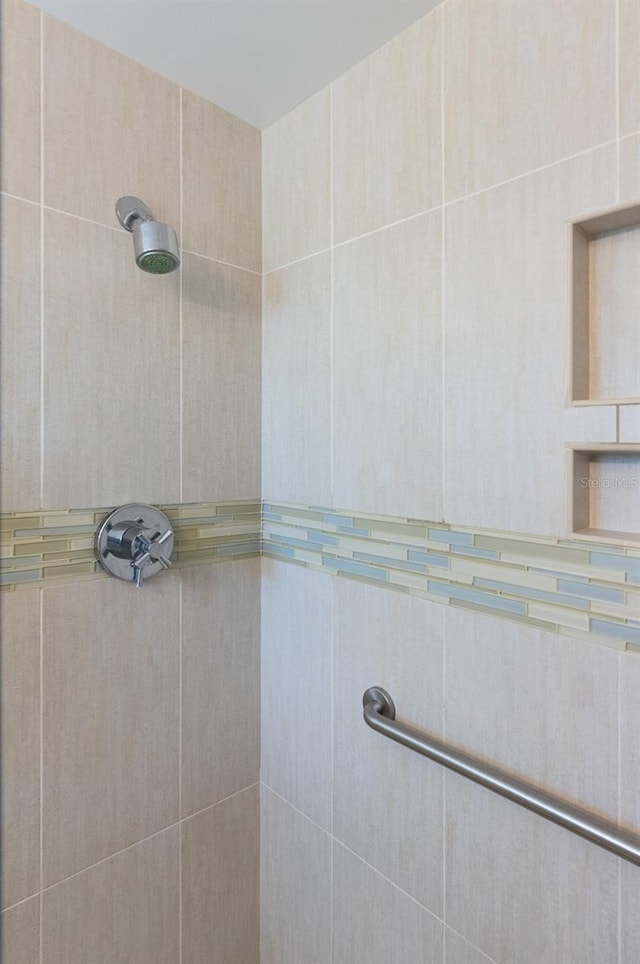 bathroom with a tile shower