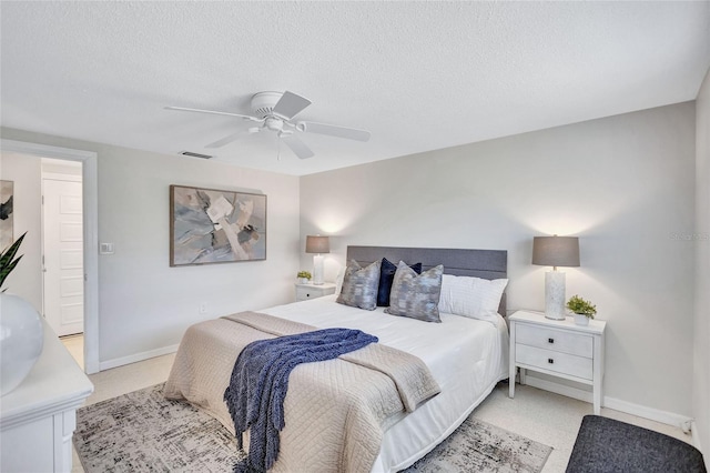 2321 Terry Ln, Sarasota, FL 34231 - bedroom featuring ceiling fan, baseboards, and a textured ceiling