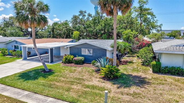 2321 Terry Ln, Sarasota, FL 34231 - single story home featuring a front lawn, driveway, and an attached carport