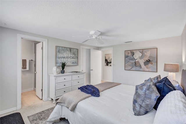 2321 Terry Ln, Sarasota, FL 34231 - bedroom featuring baseboards, light carpet, ceiling fan, and a textured ceiling