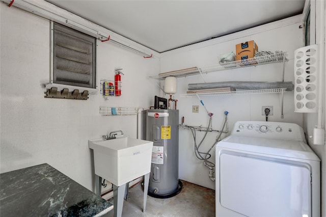 2321 Terry Ln, Sarasota, FL 34231 - laundry area with washer / dryer and water heater