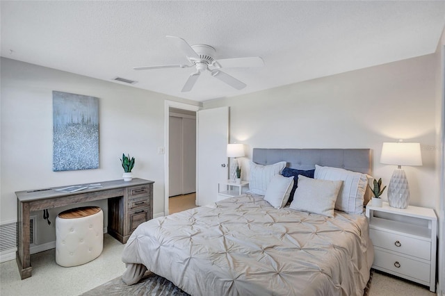 2321 Terry Ln, Sarasota, FL 34231 - bedroom featuring a ceiling fan, a textured ceiling, and baseboards